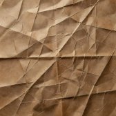 Folded paper map with deep creases on brown